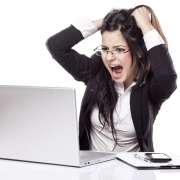 Woman at a computer pulling her hair out