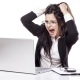 Woman at a computer pulling her hair out
