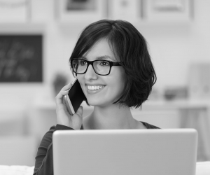 A smiling Simpleworks professional on the phone
