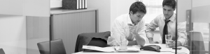 Two professionals talk on a conference call